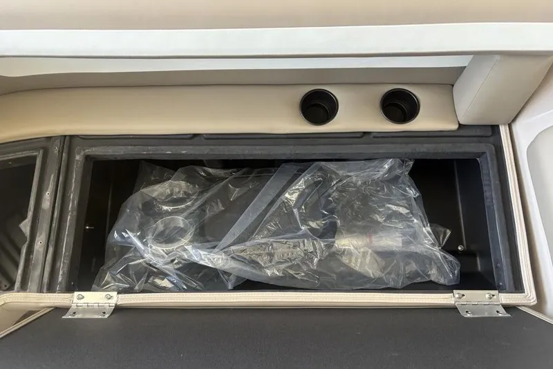 Slide: The Image of Premier 220 SUNSCAPE RL 2026 boat interior with beige captain's chair and seating. - 18