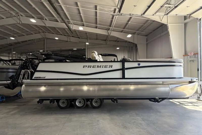 Slide: The Image of 2026 Premier 220 SUNSCAPE RL boat storage compartment with battery and wiring. - 20