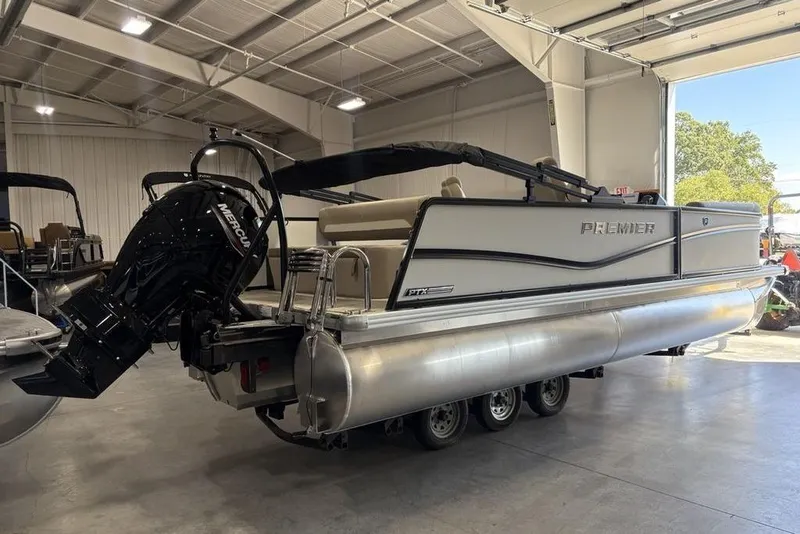 Slide: The Image of Luxurious seating on 2026 Premier 220 SUNSCAPE RL boat with storage and cup holders. - 5