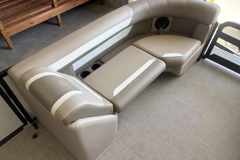 Slide: The Image of Storage compartment in 2026 Premier 220 SUNSCAPE RL boat with cup holders and plastic bag. - 8