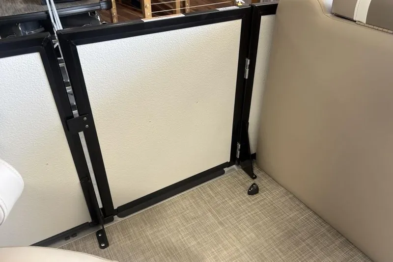 Slide: The Image of Luxurious seating on 2026 Premier 220 SUNSCAPE RL boat, featuring beige upholstery and cup holders. - 9