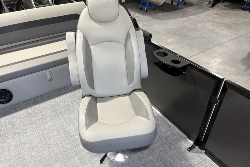 Slide: The Image of Premier 220 SUNSCAPE RL 2026 boat interior with plush seating and cup holders. - 12