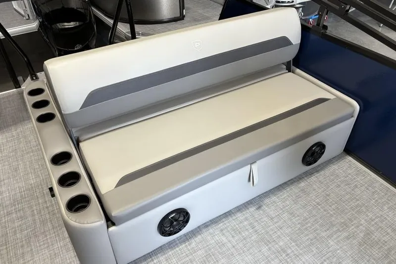 Slide: The Image of 2026 Premier 220 SUNSCAPE RL boat seat with cup holders and integrated speakers. - 14