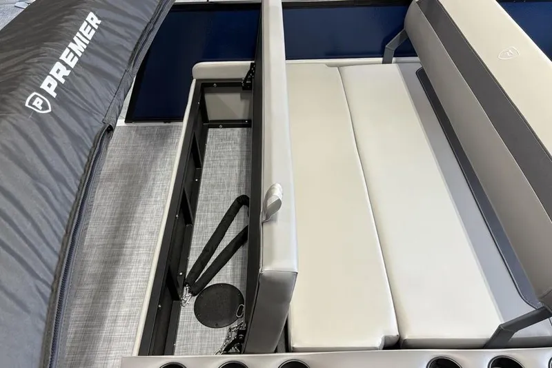 Slide: The Image of 2026 Premier 220 SUNSCAPE RL boat interior with storage compartment and seating. - 21