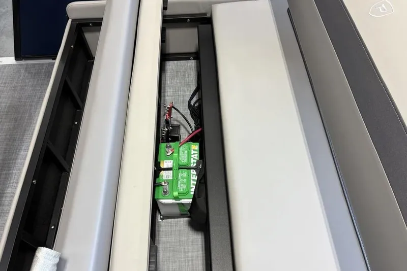 Slide: The Image of Battery compartment of 2026 Premier 220 SUNSCAPE RL boat with seating. - 22