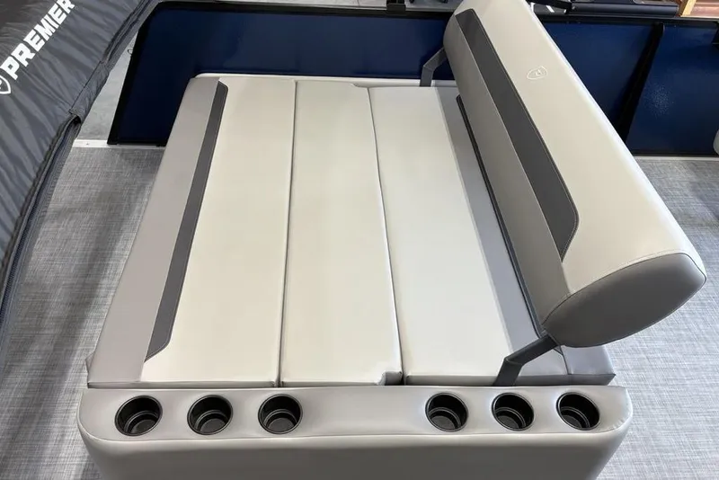Slide: The Image of 2026 Premier 220 SUNSCAPE RL boat seating with cup holders, gray upholstery. - 24
