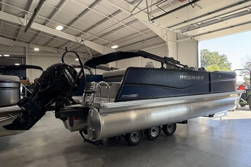 Slide: The Image of 2026 Premier 220 SUNSCAPE RL pontoon boat in a showroom, featuring a Mercury outboard motor. - 3