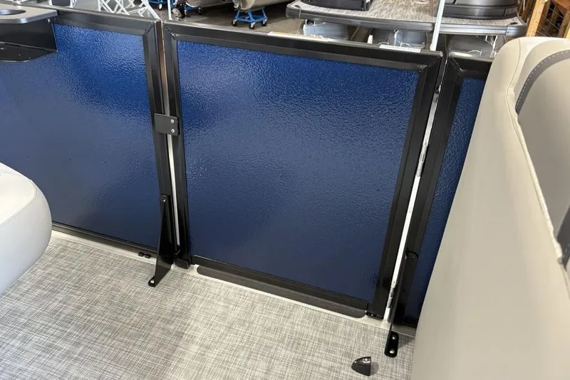 Slide: The Image of Interior view of 2026 Premier 220 SUNSCAPE RL boat with blue panel and seating. - 7