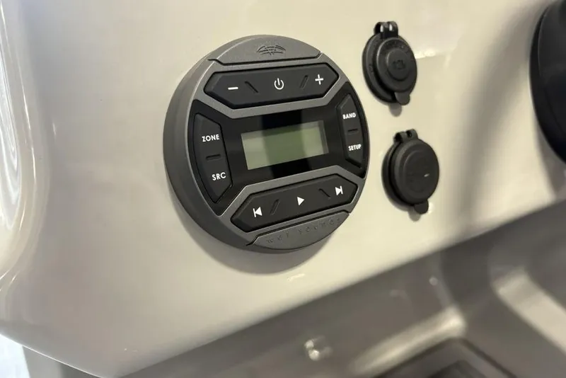 Slide: The Image of Control panel of 2026 Premier 220 SUNSCAPE RL boat with digital display and buttons. - 17
