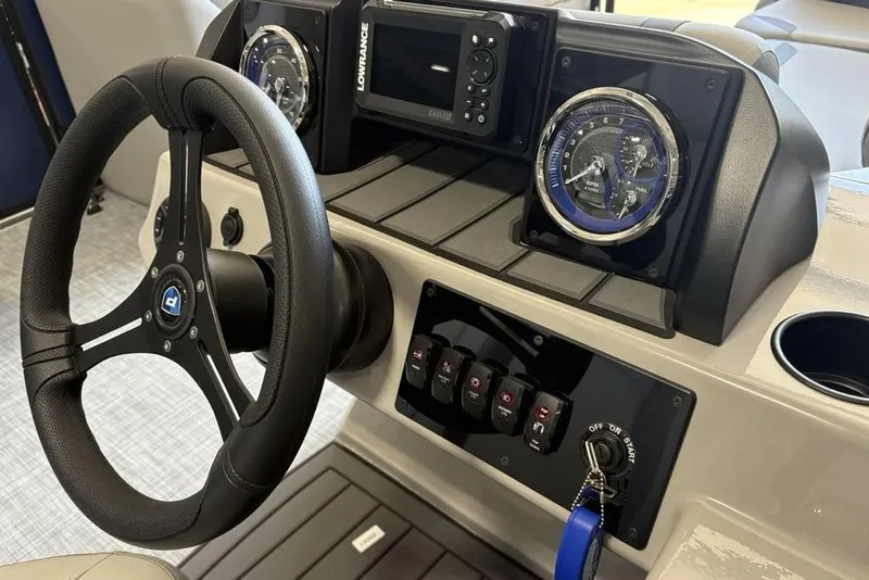 Slide: The Image of Steering console of 2026 Premier 220 SUNSCAPE RL boat with gauges and controls. - 19