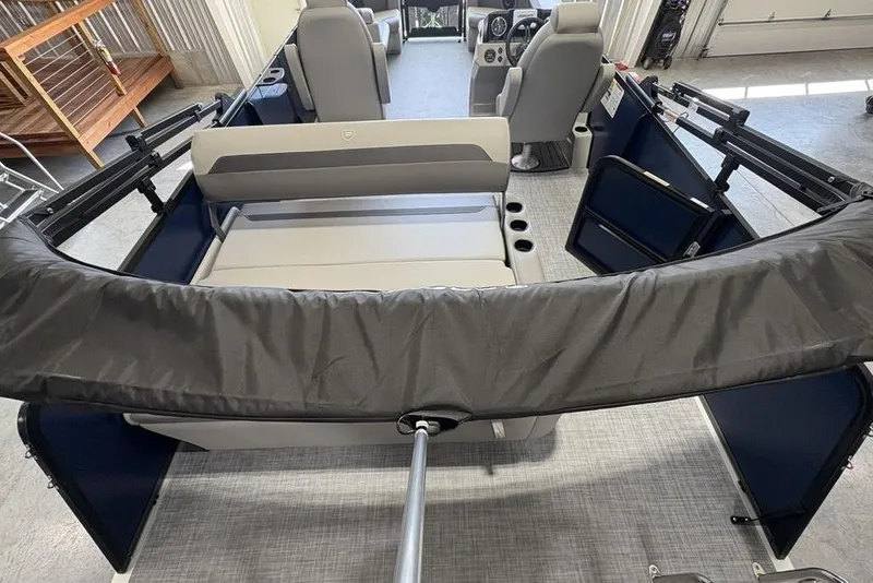 Slide: The Image of 2026 Premier 220 SUNSCAPE RL boat interior with seating and helm, showcasing modern design. - 23