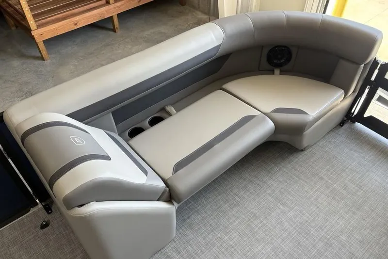 Slide: The Image of Luxurious seating in 2026 Premier 220 SUNSCAPE RL boat, featuring sleek gray upholstery. - 5