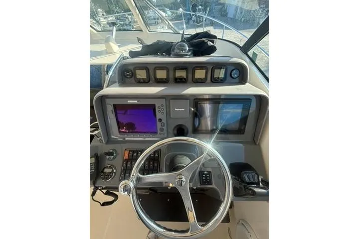 Slide: The Image of Control panel of 2010 Pursuit OS 375 Offshore boat with navigation equipment. - 10