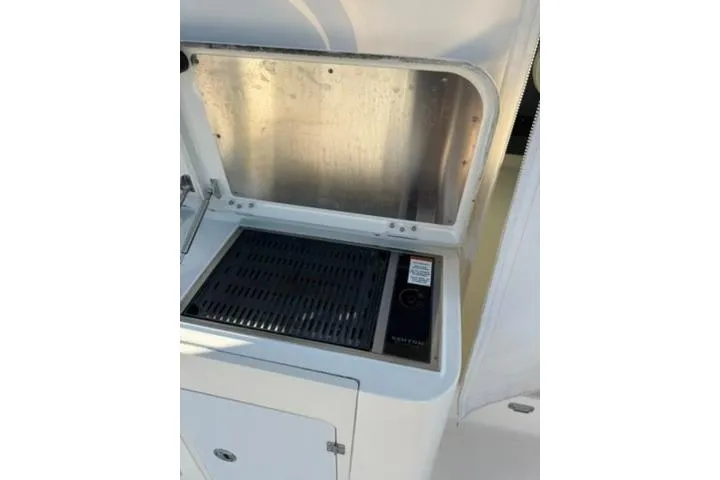 Slide: The Image of Outdoor grill on 2010 Pursuit OS 375 Offshore boat deck. - 19