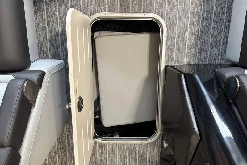 Slide: The Image of Open storage compartment in 2026 Premier 250 Solaris RS CL boat interior. - 13