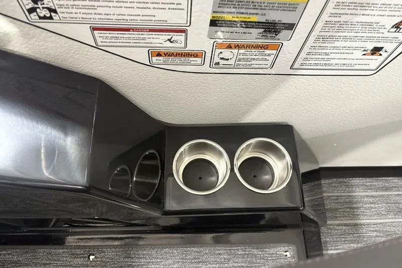 Slide: The Image of Interior of 2026 Premier 250 Solaris RS CL with cup holders and warning labels. - 18