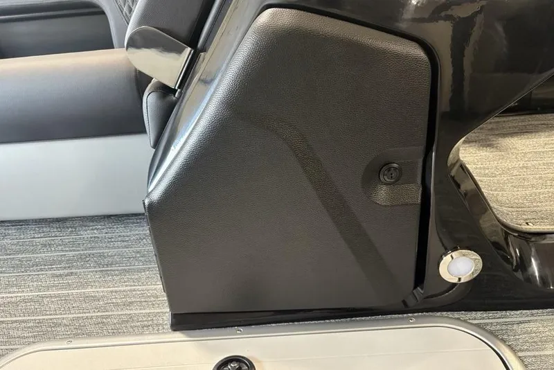 Slide: The Image of Interior detail of 2026 Premier 250 Solaris RS CL boat, featuring sleek black paneling. - 19