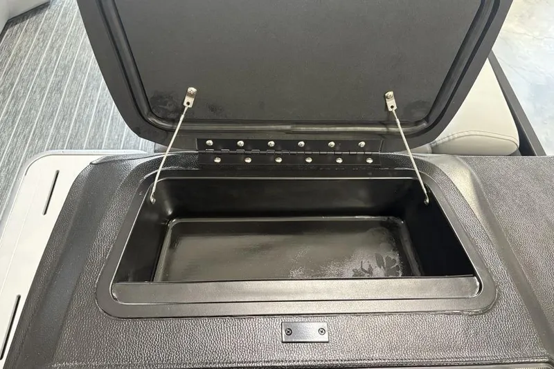 Slide: The Image of Open storage compartment in 2026 Premier 250 Solaris RS CL boat interior. - 21
