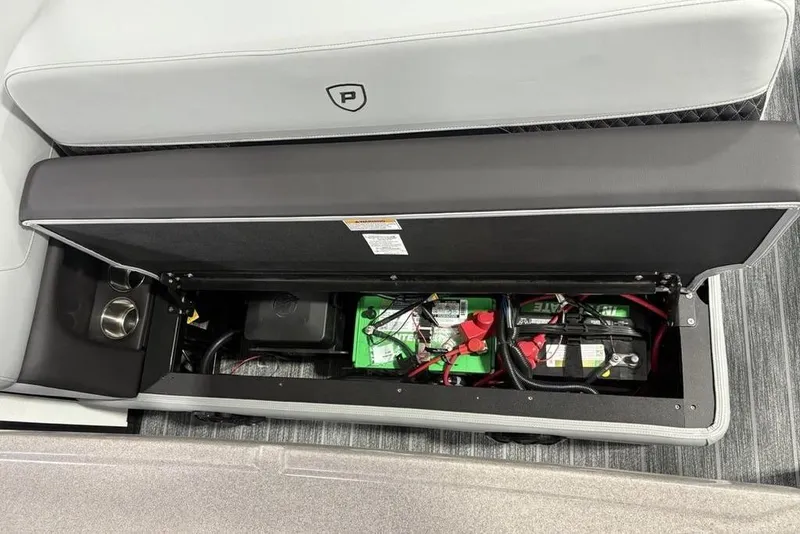 Slide: The Image of Battery compartment of 2026 Premier 250 Solaris RS CL pontoon boat, under seat storage. - 25