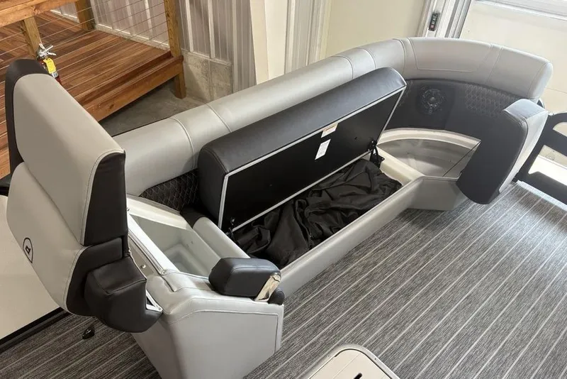 Slide: The Image of Premier 250 Solaris RS CL 2026 boat interior with storage compartments and seating. - 3