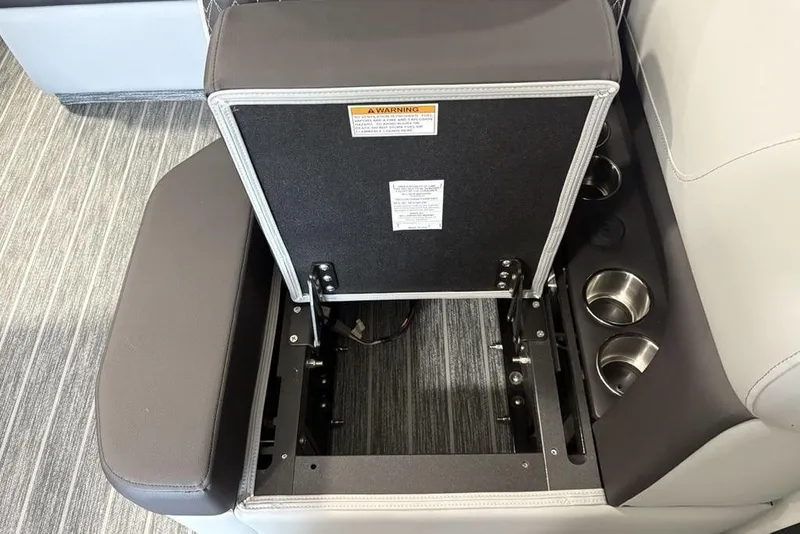 Slide: The Image of Open storage compartment in 2026 Premier 250 Solaris RS CL boat with cup holders. - 33