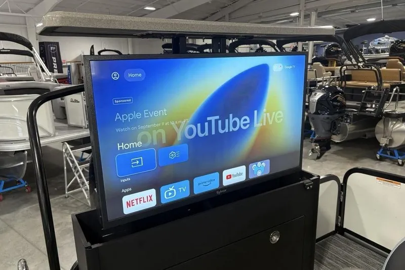 Slide: The Image of 2026 Premier 250 Solaris RS CL boat with a retractable TV displaying streaming apps. - 36