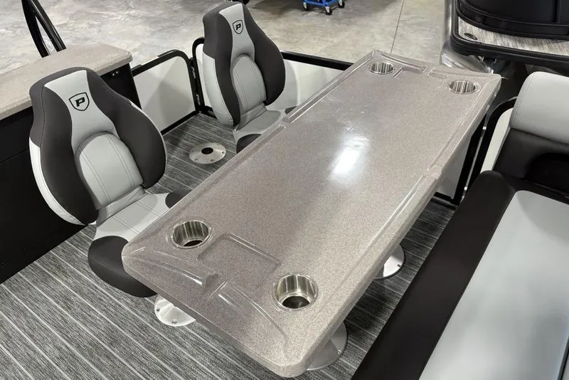 Slide: The Image of Interior of 2026 Premier 250 Solaris RS CL boat with seating and table. - 39
