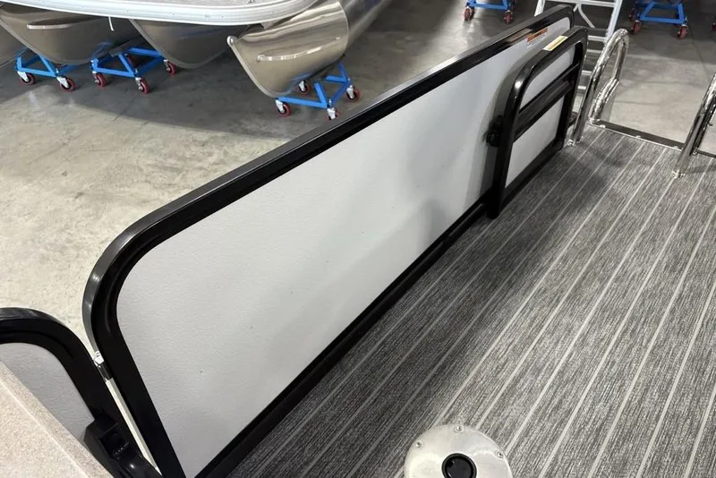 Slide: The Image of 2026 Premier 250 Solaris RS CL boat interior with sleek railing and modern flooring. - 44
