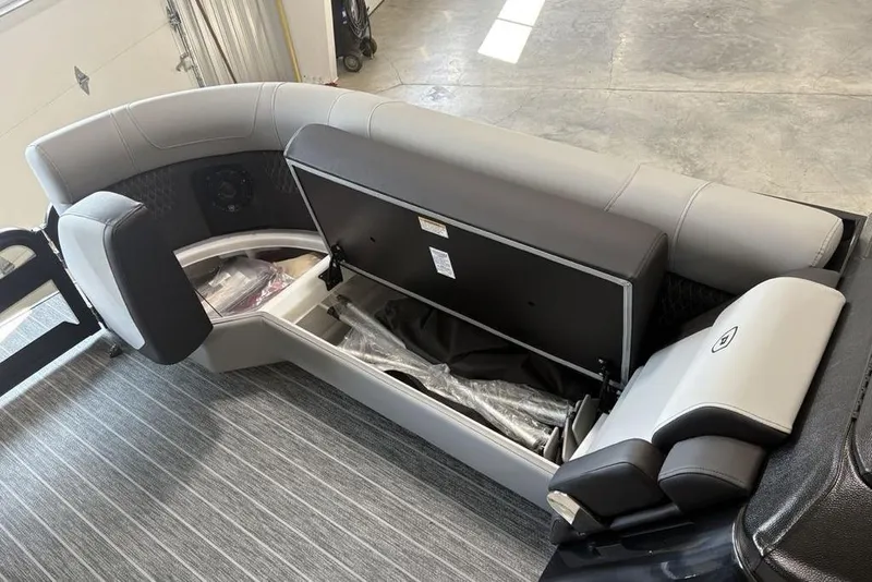 Slide: The Image of 2026 Premier 250 Solaris RS CL boat interior with open storage compartment. - 6