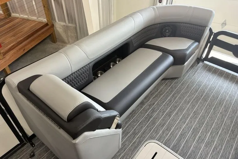 Slide: The Image of Luxurious seating in 2026 Premier 250 Solaris RS CL boat, featuring sleek design and cup holders. - 7