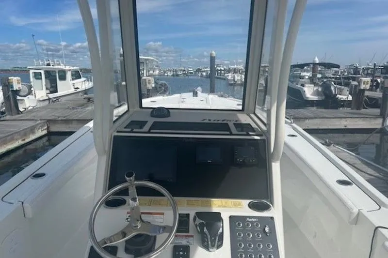 Slide: The Image of 2025 Parker 2400 Center Console boat at marina, view from helm. - 10
