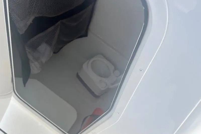 Slide: The Image of Interior view of 2025 Parker 2400 Center Console boat with portable toilet. - 11