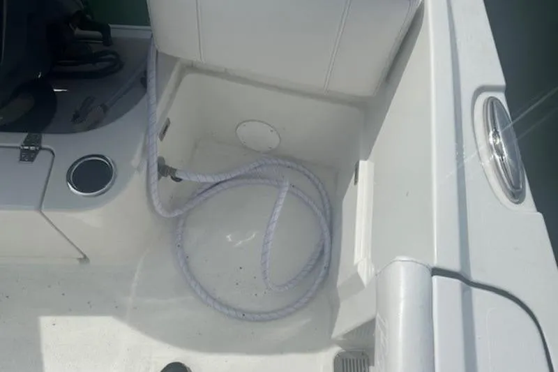 Slide: The Image of Interior view of a 2025 Parker 2400 Center Console boat with coiled rope. - 12