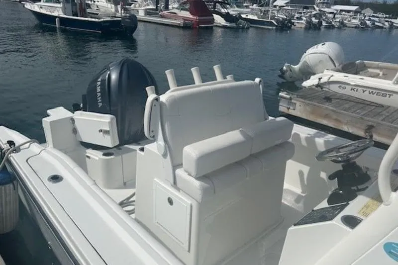 Slide: The Image of 2025 Parker 2400 Center Console boat docked at marina with Yamaha outboard. - 18