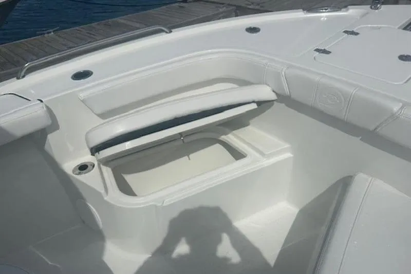 Slide: The Image of 2025 Parker 2400 Center Console boat interior with open storage compartment. - 8