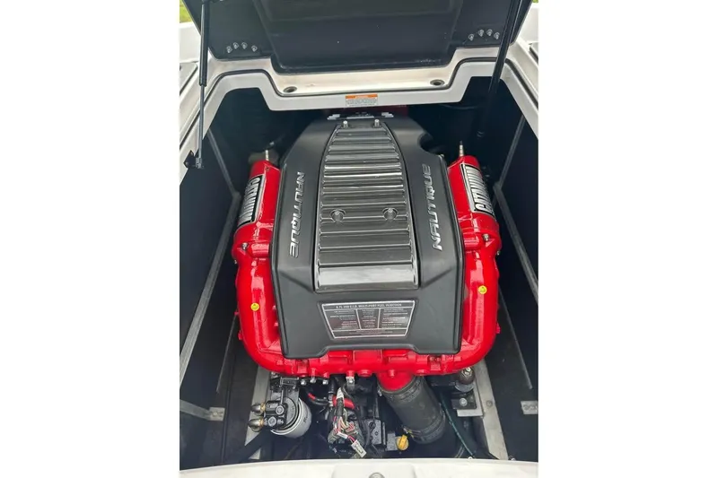 Slide: The Image of 2015 Nautique Super Air Nautique 210 engine with red accents and Nautique branding. - 5