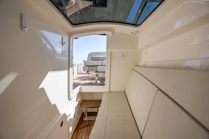 Slide: The Image of Interior view of 2023 Boston Whaler 320 Vantage, featuring comfortable seating and sleek design. - 15