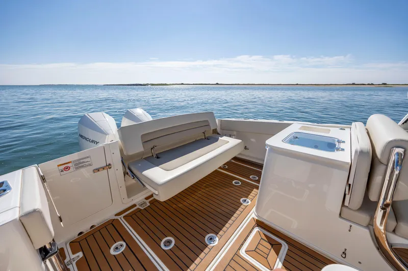 Slide: The Image of 2023 Boston Whaler 320 Vantage boat interior with seating and ocean view. - 20