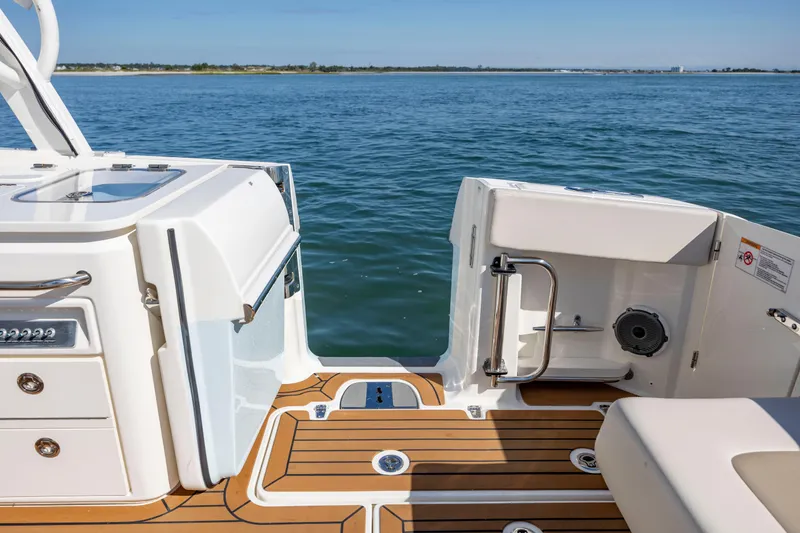 Slide: The Image of 2023 Boston Whaler 320 Vantage boat deck with ocean view, featuring sleek design and modern amenities. - 21