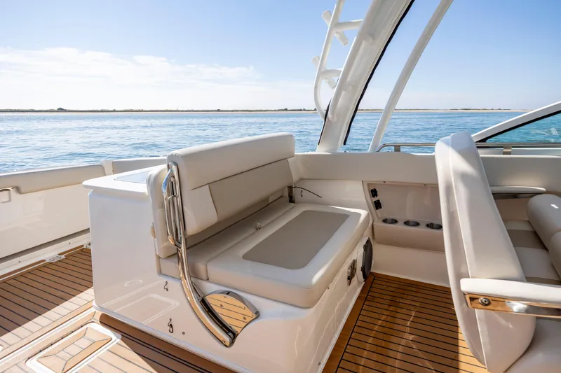 Slide: The Image of 2023 Boston Whaler 320 Vantage interior with luxurious seating and ocean view. - 28