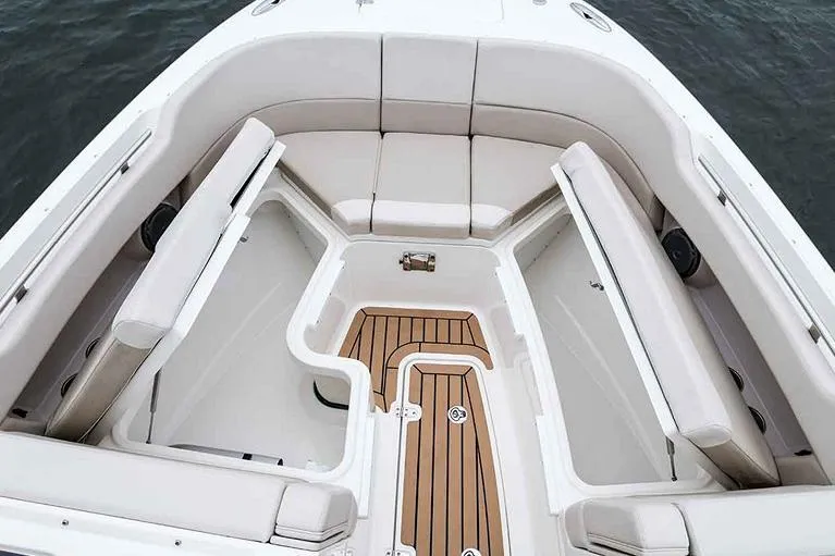 Slide: The Image of 2023 Boston Whaler 320 Vantage cruising on open water, showcasing sleek design and performance. - 3