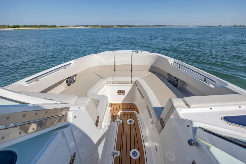 Slide: The Image of 2023 Boston Whaler 320 Vantage boat interior with spacious seating and ocean view. - 38