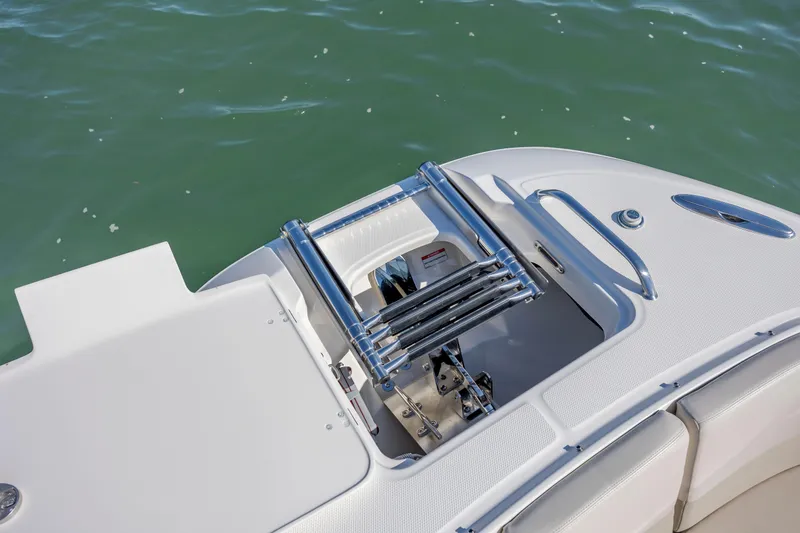 Slide: The Image of 2023 Boston Whaler 320 Vantage boat with stainless steel swim ladder and white deck. - 39