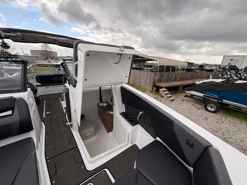 Slide: The Image of Interior of 2024 Scarab 285 Wake ID boat with storage area. - 25