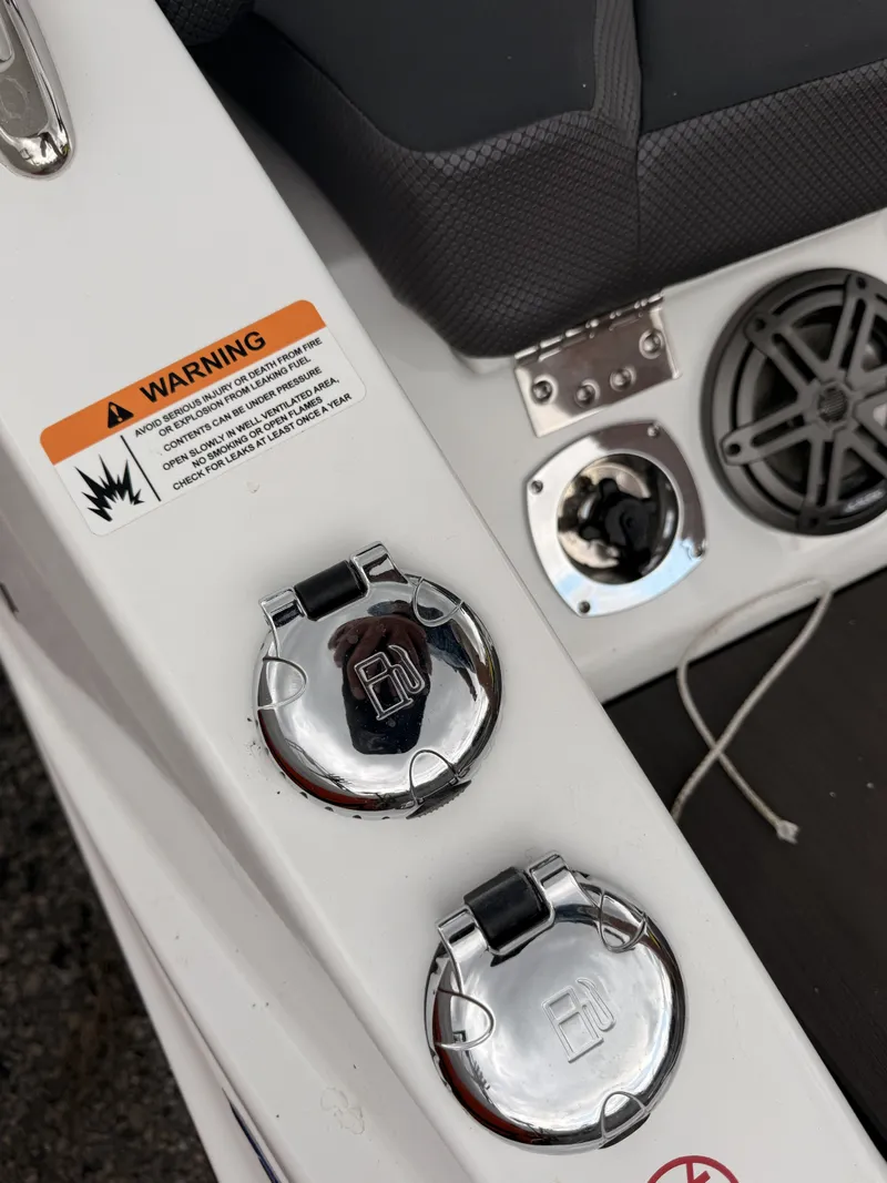 Slide: The Image of 2024 Scarab 285 Wake ID boat fuel caps and speaker. - 32