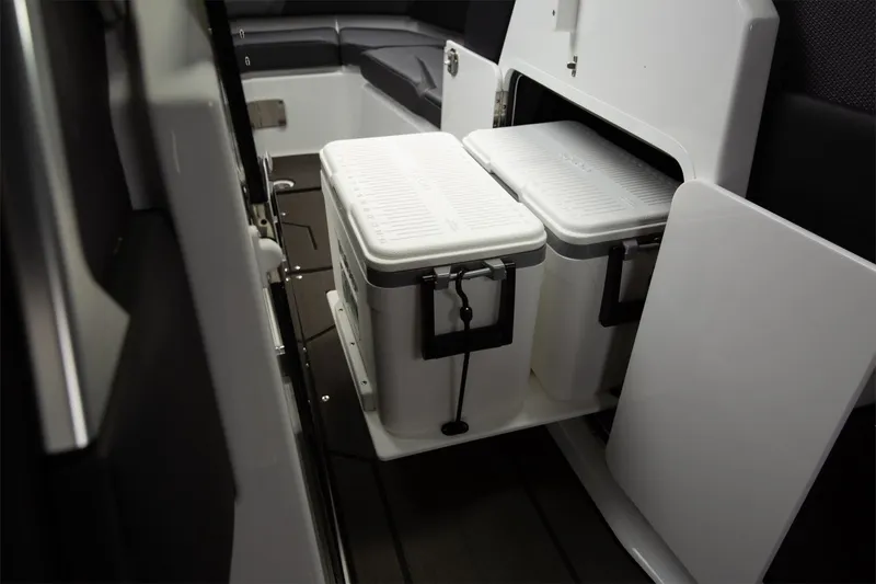 Slide: The Image of Scarab 285 Wake ID 2024, open storage compartment on boat. - 9