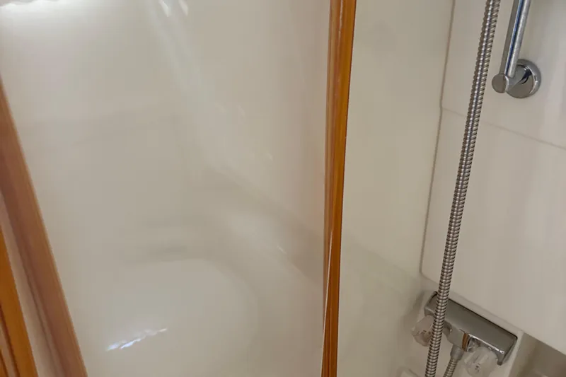 Slide: The Image of Shower area inside 2000 Formula 34 Performance Cruiser yacht, featuring sleek design and fixtures. - 14