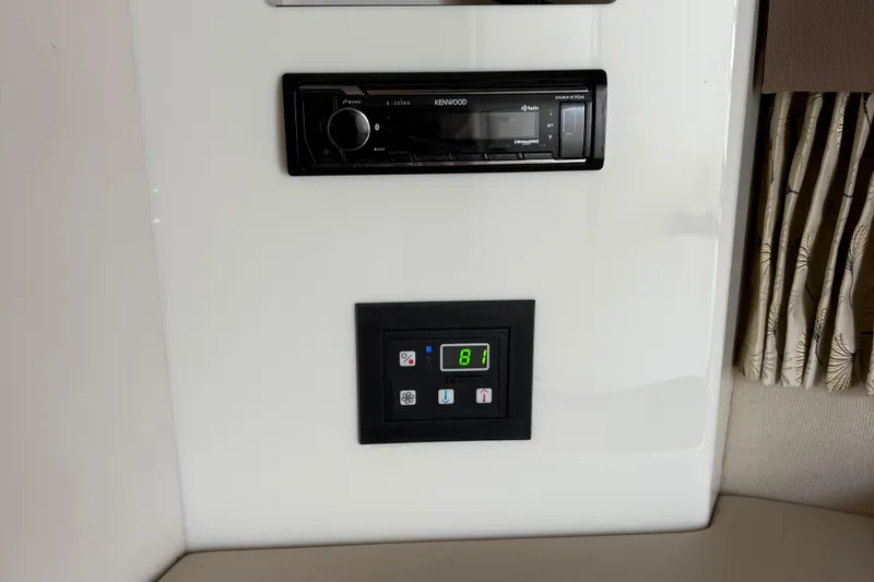 Slide: The Image of Control panel and stereo system in 2000 Formula 34 Performance Cruiser boat interior. - 15