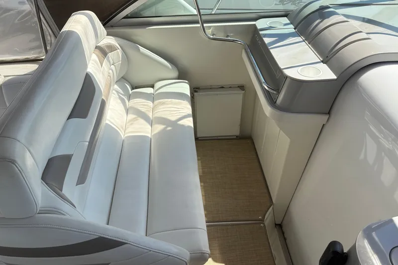 Slide: The Image of Interior of a 2000 Formula 34 Performance Cruiser with white seating and helm area. - 5