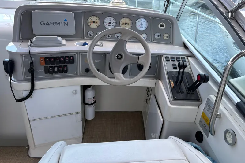 Slide: The Image of Cockpit of 2000 Formula 34 Performance Cruiser with Garmin navigation system and control panel. - 6